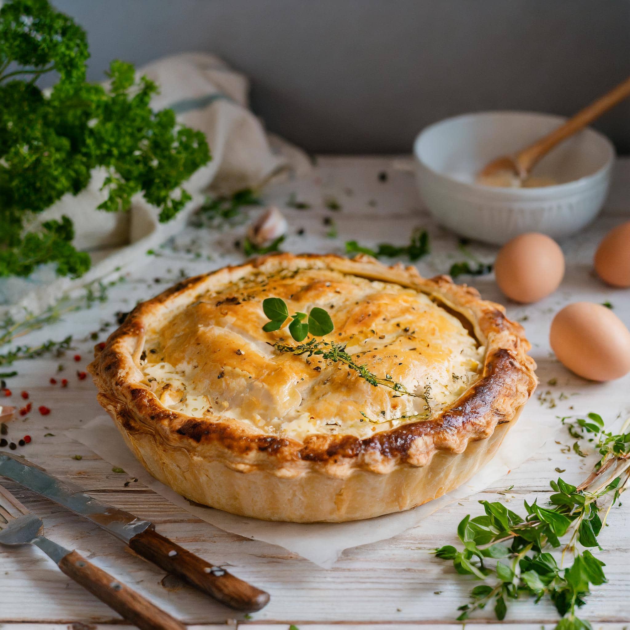 Homemade chicken pot pie with golden crust and creamy sauce